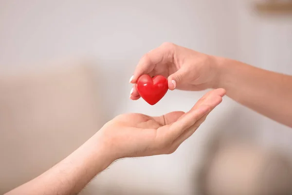 depositphotos_286315472-stock-photo-woman-giving-red-heart-to